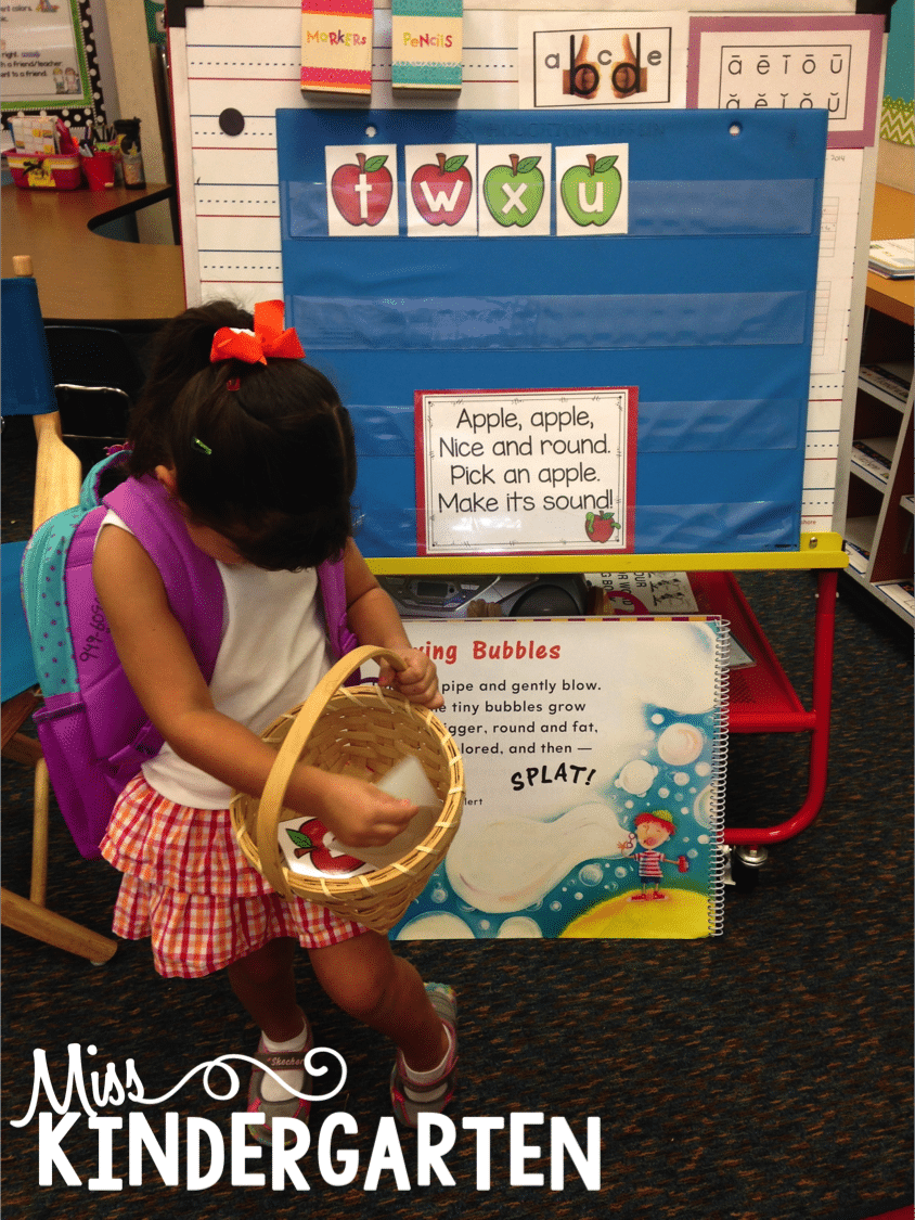 Choosing an apple to find the alphabet sounds